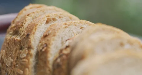 Closeup slow motion sliced breads on breakfast table. Video stock 91010187