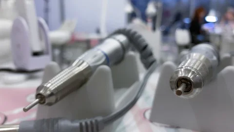 Closeup. Slow motion. Smooth movement.  Electric Nail Drill in Manicure Salon Видео 120075490