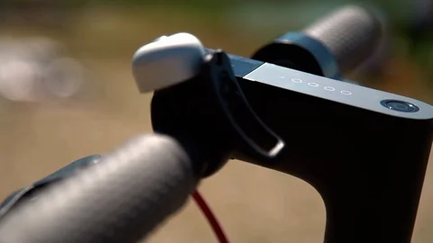 Closeup slow motion tracking shot of helm of electric scooter. Isolated. Outdoor Video stock 123712517