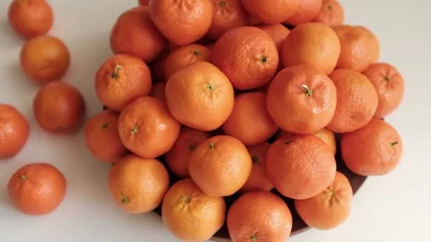 Closeup slow motion video of bright tangerines. Stock Footage 325432888
