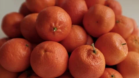 Closeup slow motion video of bright tangerines. Stock Footage 325432890