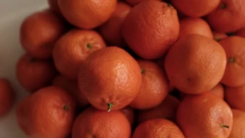 Closeup slow motion video of bright tangerines. Stock Footage 325432909
