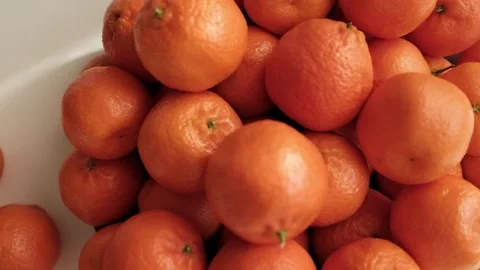 Closeup slow motion video of bright tangerines. Stock Footage 325432974