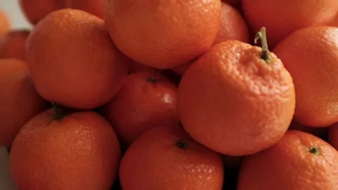 Closeup slow motion video of bright tangerines. Stock Footage 325433063