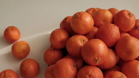 Closeup slow motion video of bright tangerines. Stock Footage 325433090