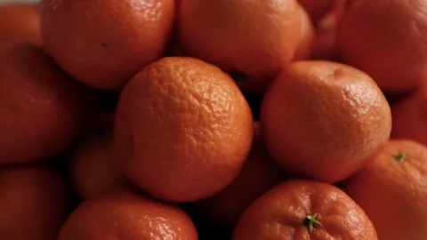 Closeup slow motion video of bright tangerines. Stock Footage 325433168