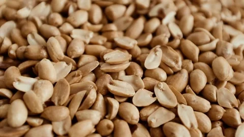 Closeup slow motion video of roasted clean peanuts healthy snack. Stock Footage 325345207