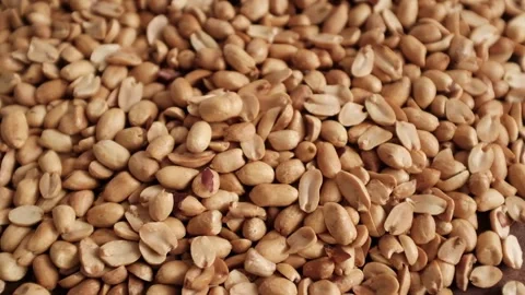 Closeup slow motion video of roasted clean peanuts healthy snack. Video stock 325345236