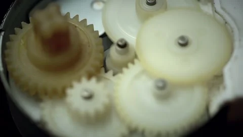 Closeup on slowly rotating dark metallic gears.,Mechanical movement Industrial c Stock Footage 196685680