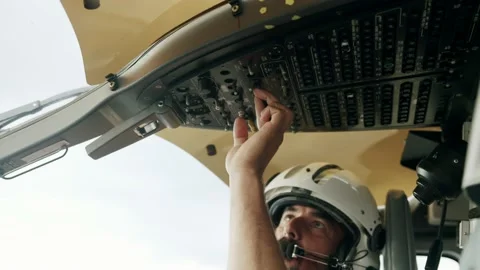 Closeup slowmotion shot of Pilot starting and turning on knobs in 스톡 동영상 169134820