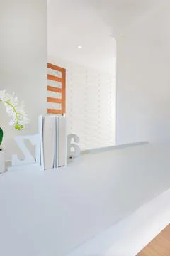 Closeup of a small book shelf on the empty white table decorated with 3d lett Stock Photos