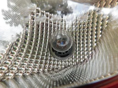 Closeup of small bulb fixed inside of the car light set Foto stock