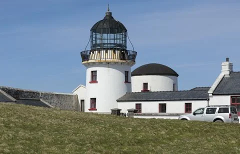 Closeup of a small lighthouse painted red and white Stock Photos