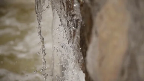 Closeup of small mini waterfall. river creek water running down the rock Stock Footage 121280665
