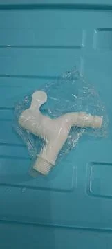 Closeup of a small plastic faucet Stock Photos