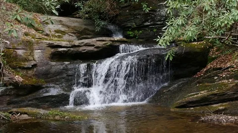 Closeup of Small Waterfall deep in the mountains Stockbeeldmateriaal 74900744