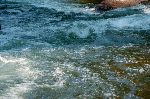 A Closeup of Small Waves on a River Stock Photos