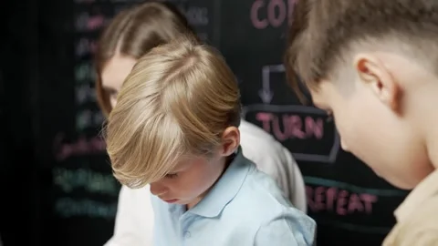 Closeup of smart happy boy fixing mother board surrounded by friend. Erudition. Stock Footage 266065623
