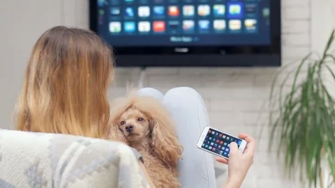 Closeup of a smart phone is connected to a smart TV. Stock Footage 72823285