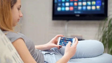 Closeup of a smart phone is connected to a smart TV. 動画素材 72823294