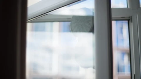 Closeup of smart robot window cleaner washing glass with round rags inside Stock Footage 265027069