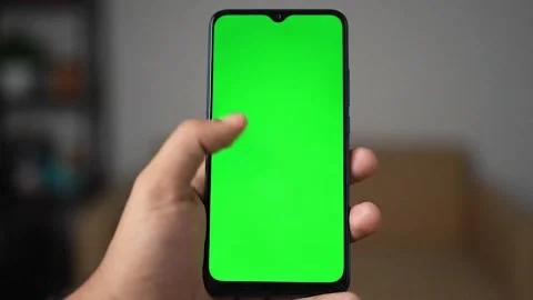 Closeup of a smartphone held vertically green screen Stock Footage 317813779