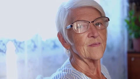 Closeup smiling beautiful old lady portrait looking in camera with happy face Stock Footage 163311092