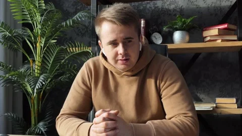 Closeup smiling man talking mobile phone in office. Close up of cheerful Stock Footage 233725693