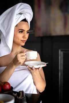 Closeup smiling morning lady in white towel relaxing drinking coffee cup Stock Photos