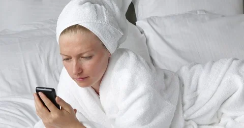 Closeup Smiling Woman Using Smartphone App Lying Bed In Bath Gown Typing Message Stock Footage 72794635
