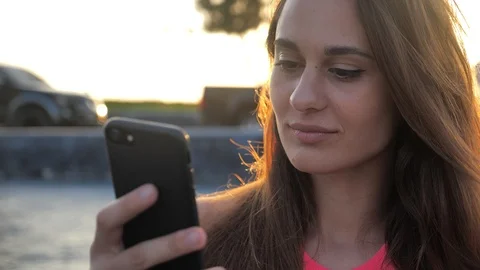 Closeup of smiling young elegant attractive girl with deep brown eyes in black Stock Footage 123964039