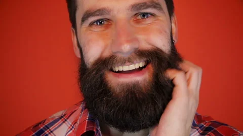Closeup of smiling young man looking at camera isolated on white background Stock Footage 62783673