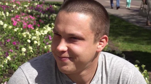 Closeup of smiling young man looking at camera who changes facial expressions Stock-Footage 75209875