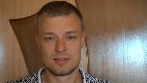 Closeup of smiling young man looking at camera isolated on white background Stock Footage 79192506