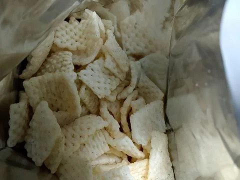 Closeup of snacks in opened plastic container. Фото