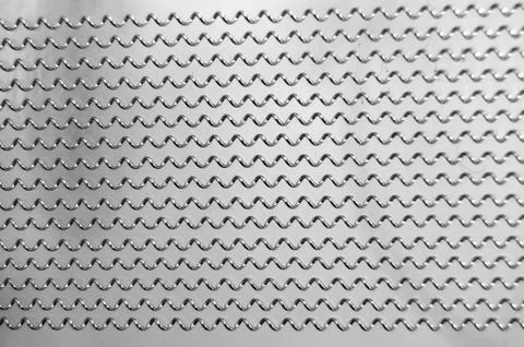 Closeup of snares on the backside of a snare drum. these are little metal spr Stock Photos