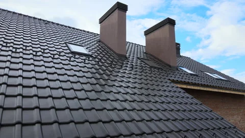 Closeup snow guard for safety in winter on house roof top covered with ceramic Stock Footage 166558434