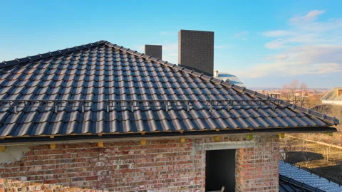 Closeup snow guard for safety in winter on house roof top covered with ceramic Stock Footage 167482143
