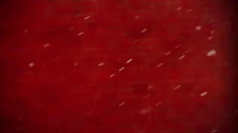 Closeup of snowflakes in front of a red wall Stock Footage 268621572