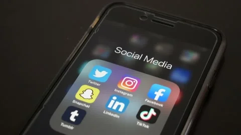Closeup of social media app icons on iPhone Stock Footage