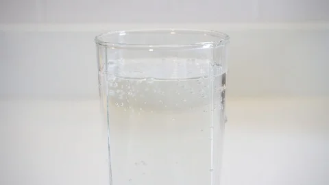 Closeup soda water with moving bubble in a glass Stock Footage 108983793