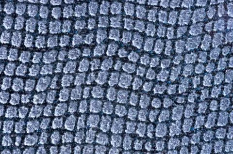 Closeup of soft cushion surface with square textures Stock Photos