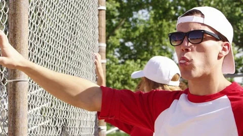 Closeup of softball boy blowing a bubble Stock-Footage 80133739