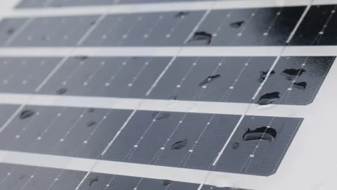 Closeup solar panel surface with water rain droplets Vidéo 334850989