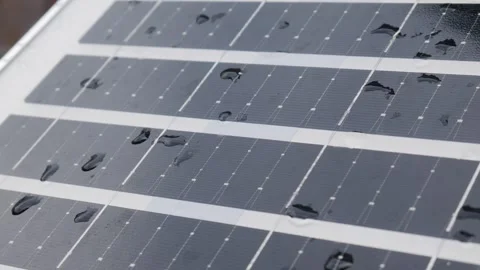 Closeup solar panel surface with water rain droplets 库存影片 334851013