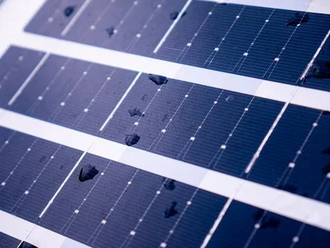 Closeup solar panel surface with water rain droplets showing photovoltaic c.. Stock Photos