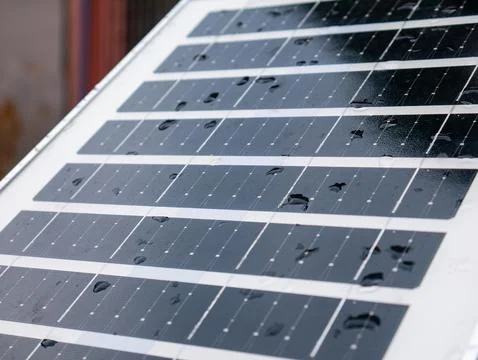 Closeup solar panel surface with water rain droplets showing photovoltaic c.. Stock Photos