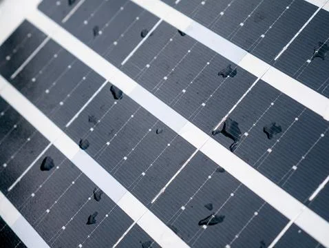 Closeup solar panel surface with water rain droplets showing photovoltaic c.. Stock Photos
