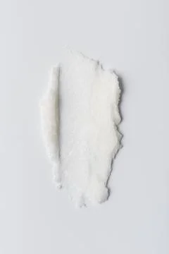 Closeup of solid white coconut oil with rich, creamy texture on white backgro Foto stock