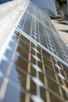 Closeup of some solar panels reflecting surroundings Stock Photos